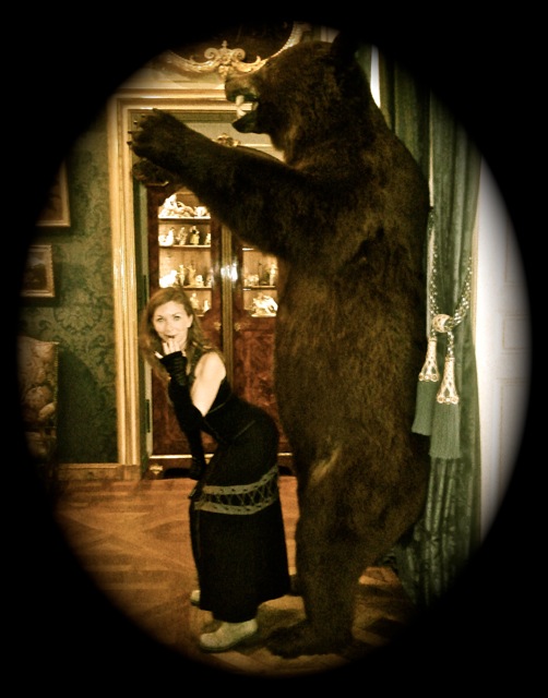 Mistress T with a big black bear.