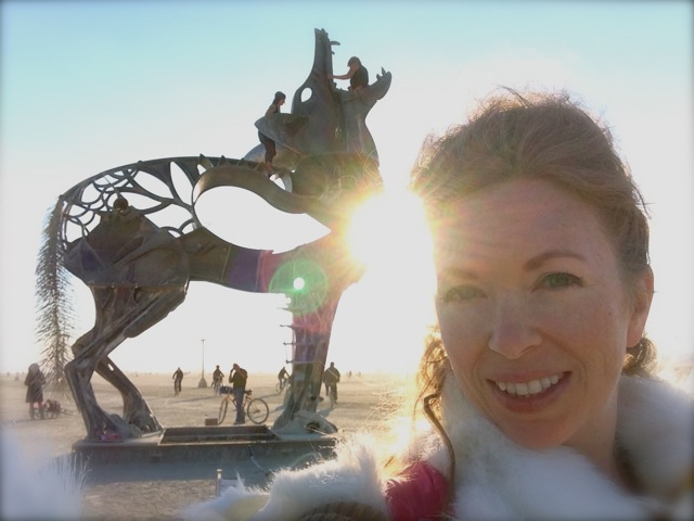 Mistress T in front of iron wolf at Burning Man 2013.