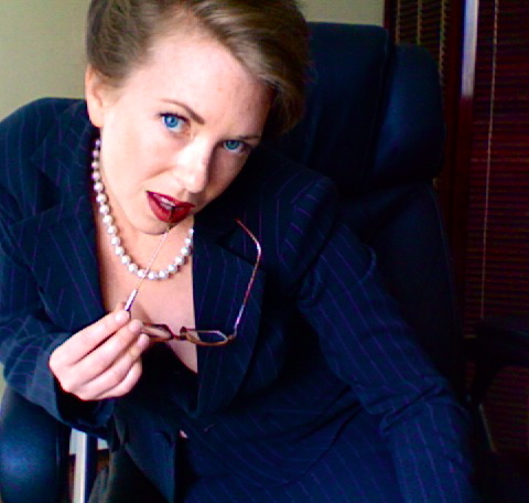 Mistress T in a business suit.